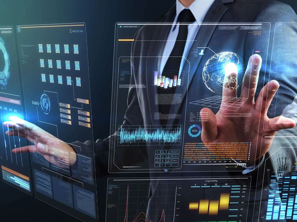 A business professional using a futuristic holographic data interface.