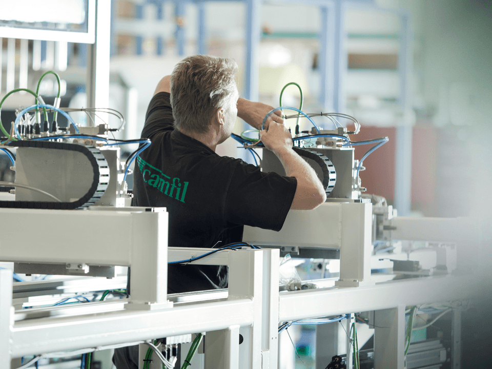 Camfil employee working in the factory machinery