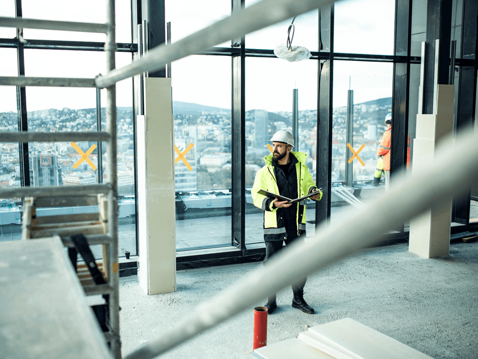 Man in construction site with hard hat