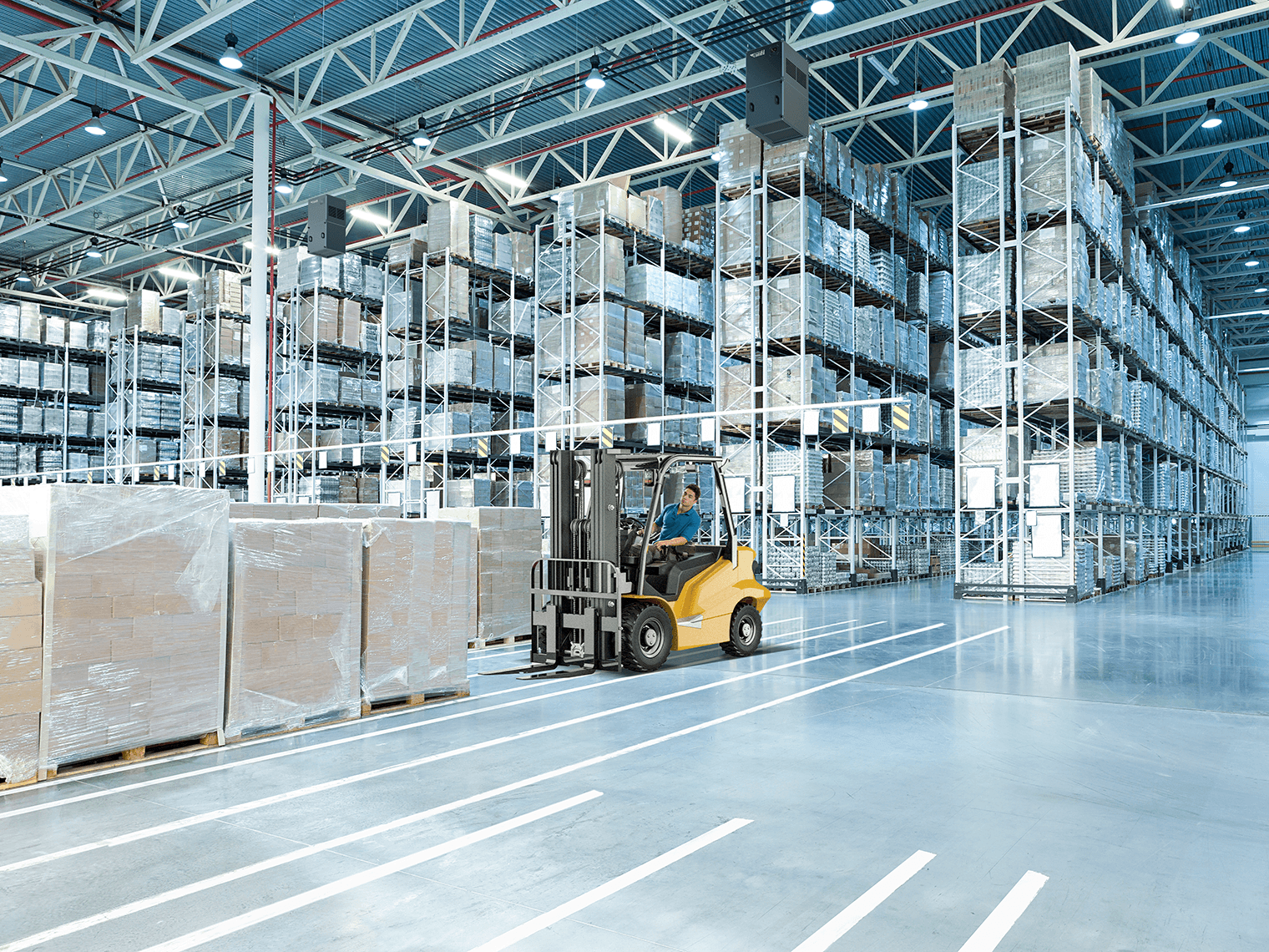 Forklift with employee in warehouse