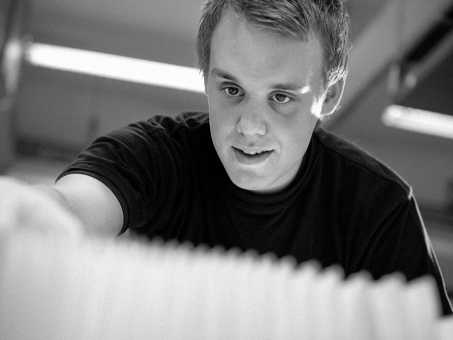 Young man in factory working