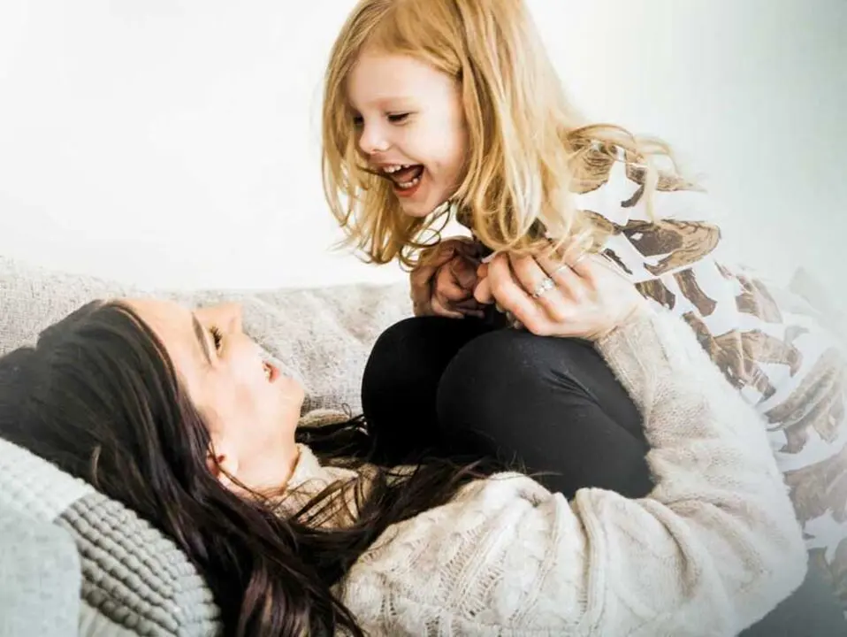 Woman playing with child