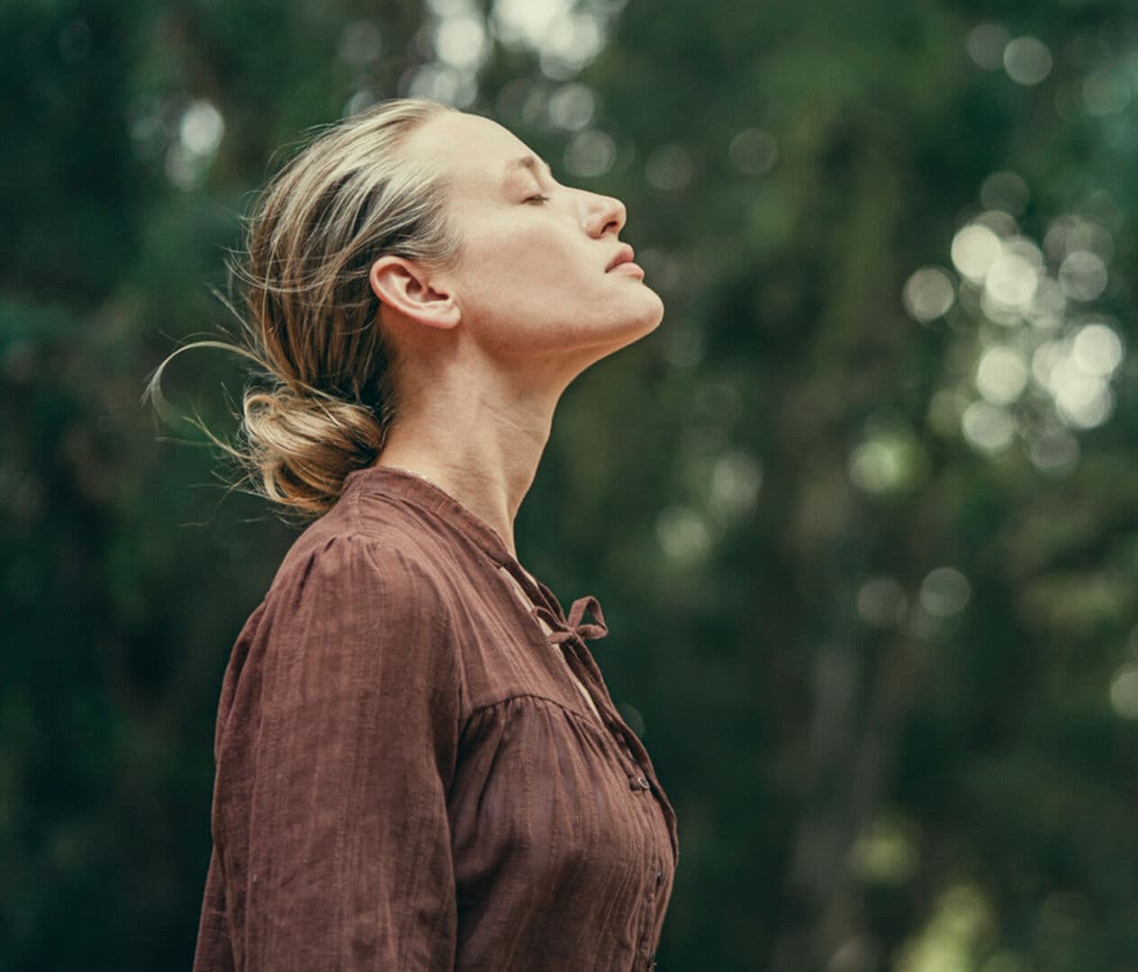 Woman breathing outdoors