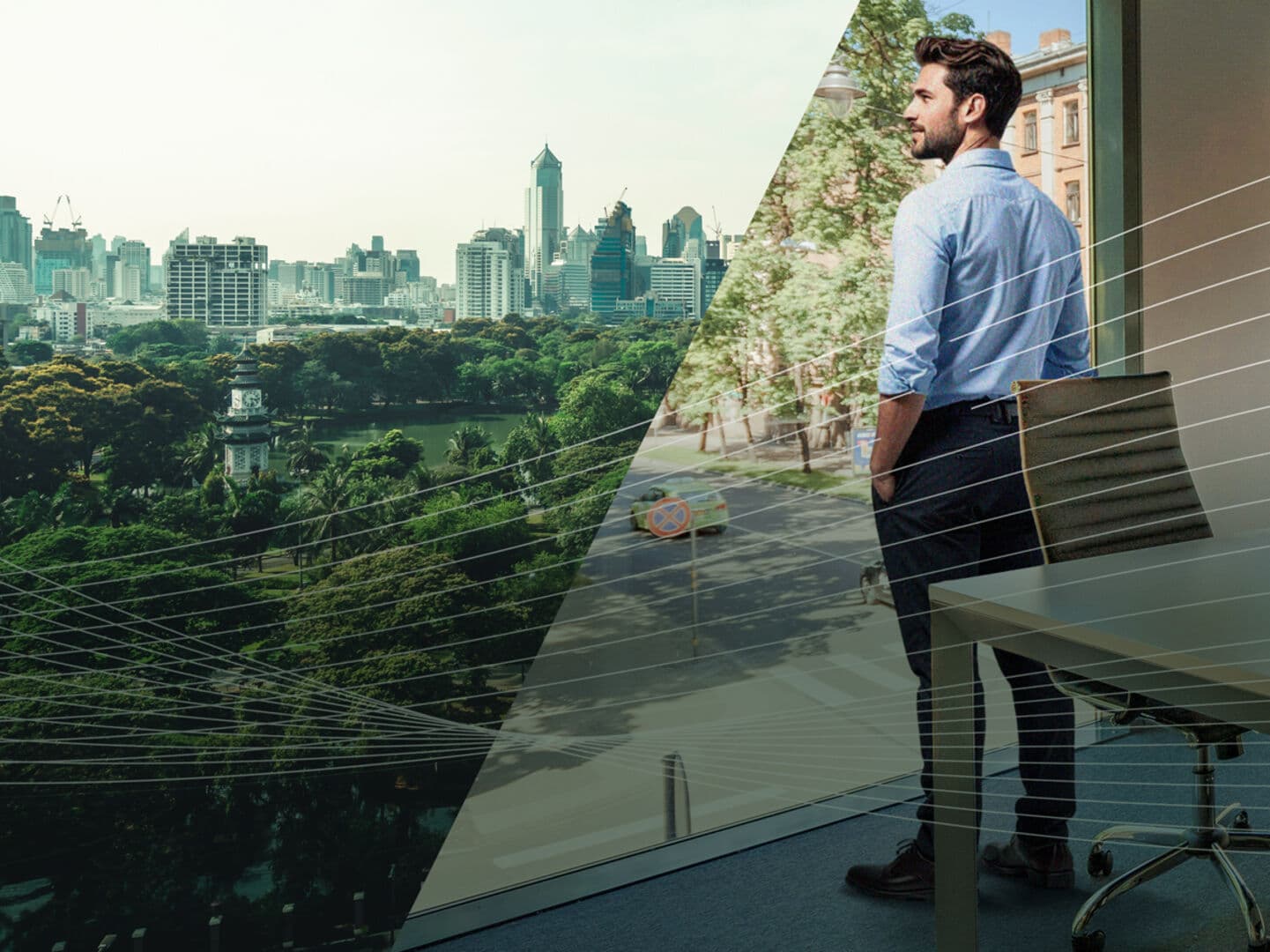 Ein Mann steht am Fenster und Blickt nach draußen in eine städtische Umgebung