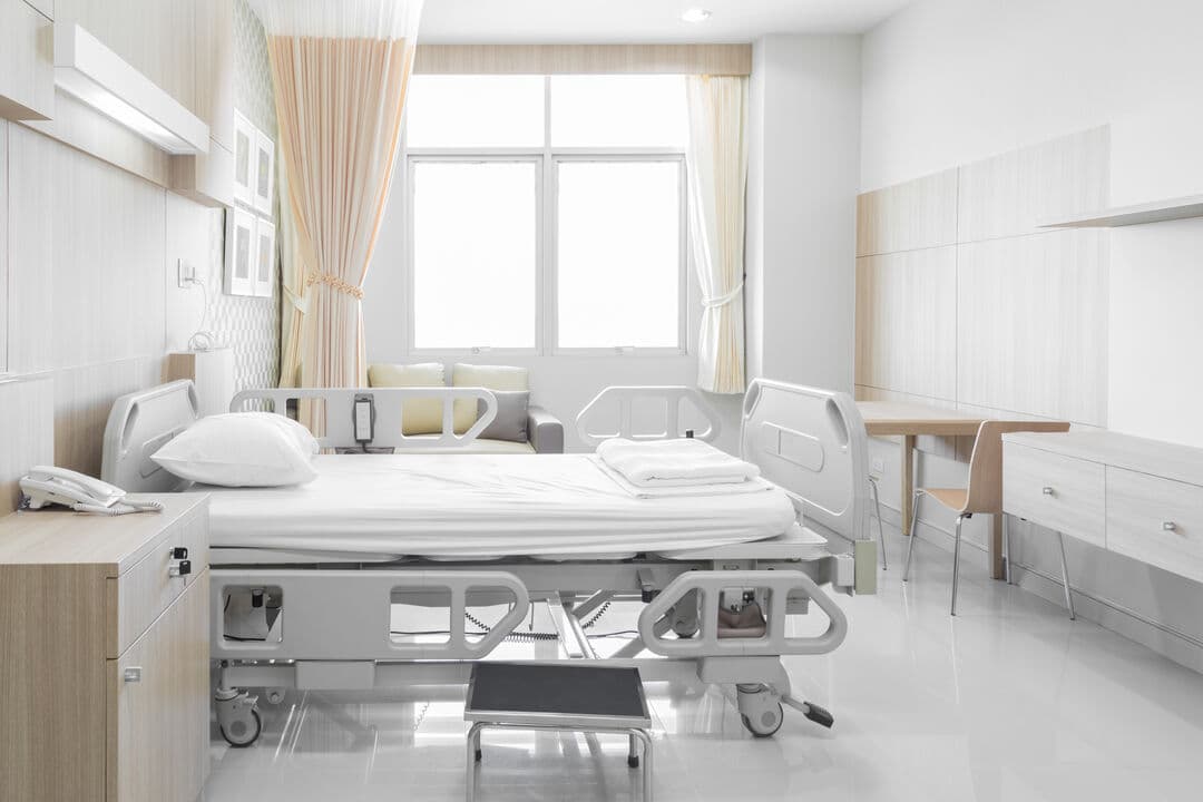 A hospital bed in a patient room.