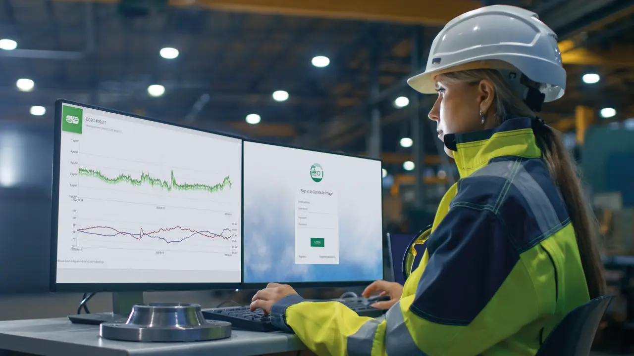 Woman working in industrial environment.