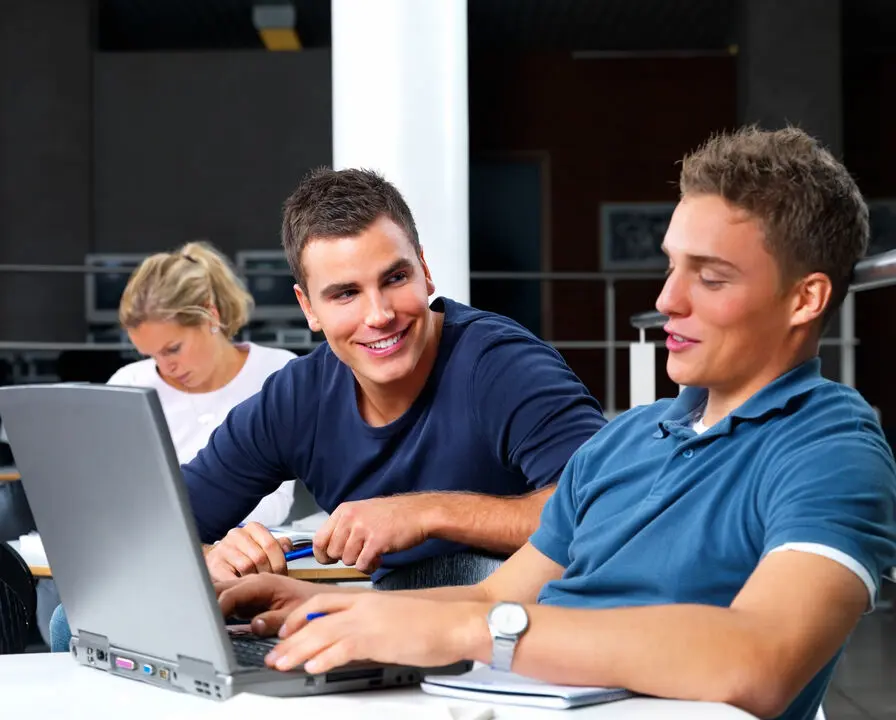 A man giving a presentation to a group of attentive listeners