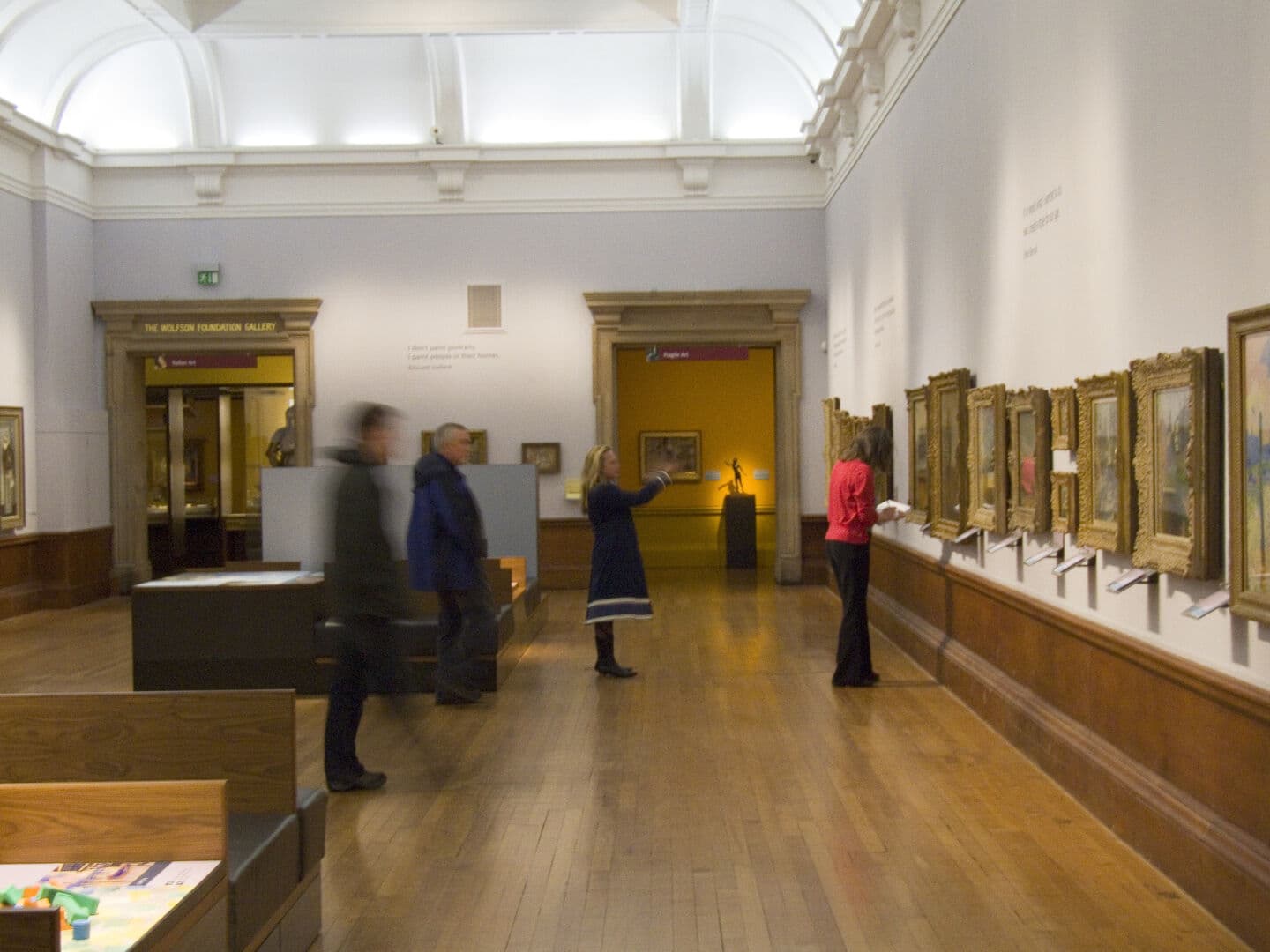 Museum - People viewing painting in a museum