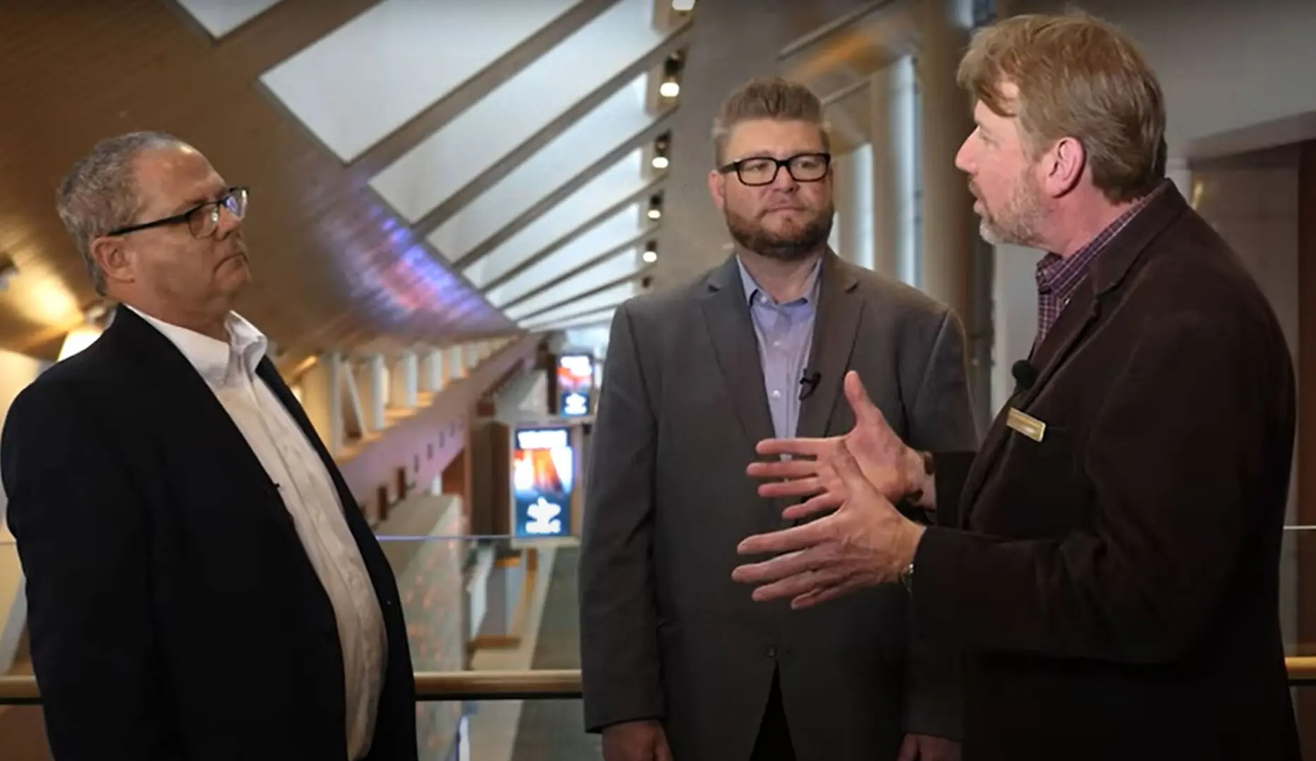 Men talking inside the music city center