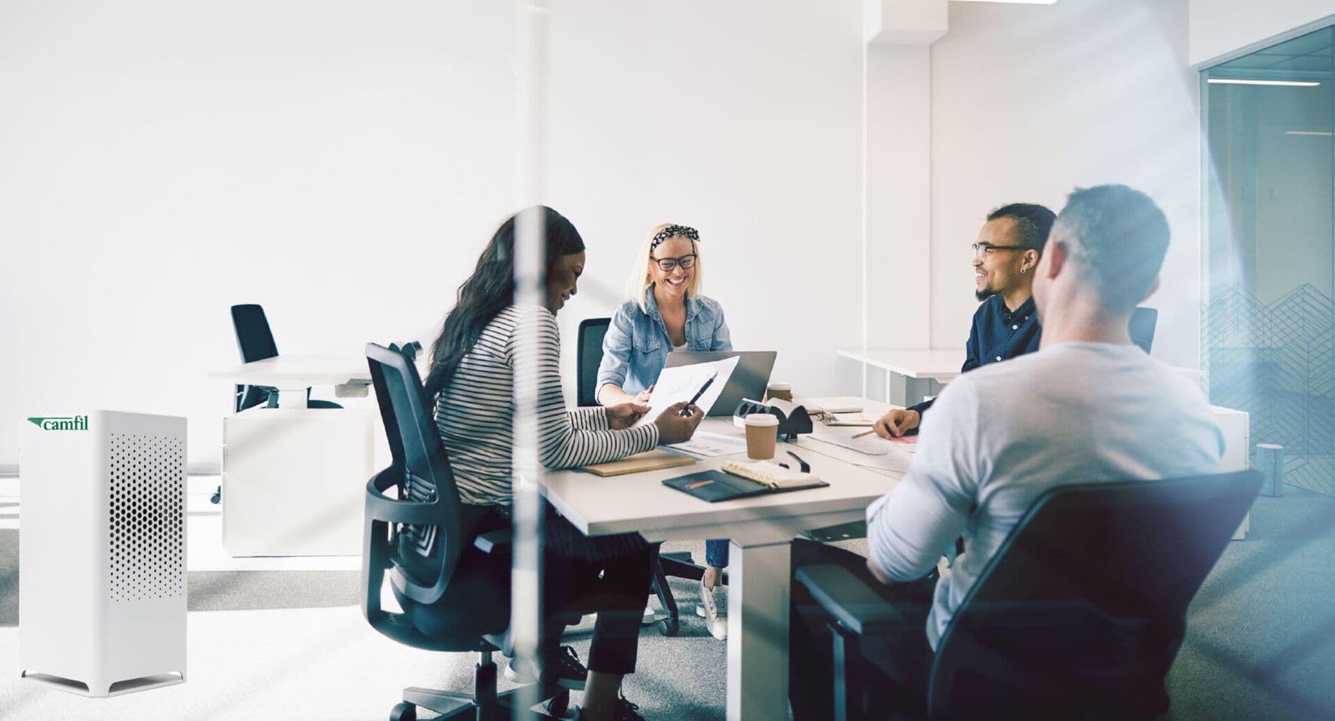 Group of people inside an office in a meeting
