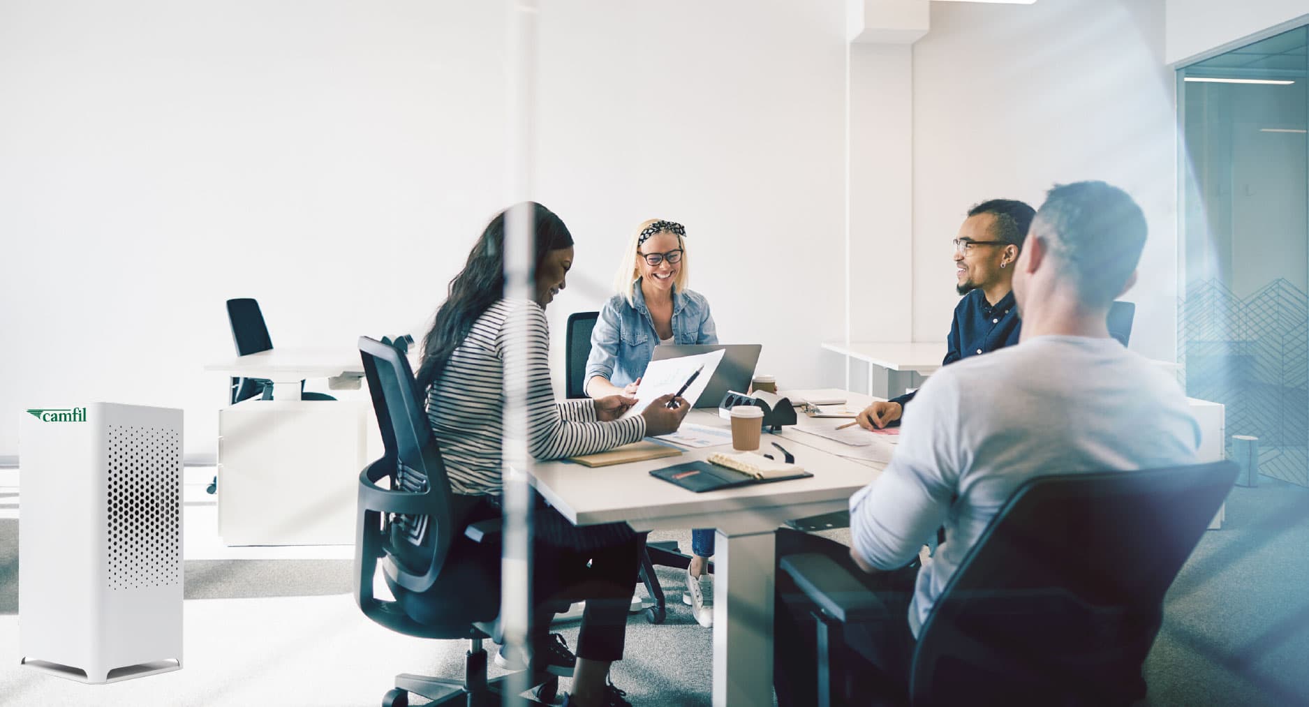Group of people inside an office in a meeting