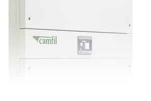 A large white rectangular metal box has a green Camfil label and a small electronic panel on an industrial air purifier or air purifier hepa, industrial air cleaner.